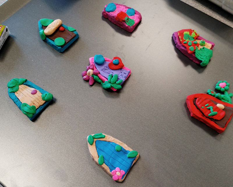 clay fairy door magnets by fairy club students at bonneville academy