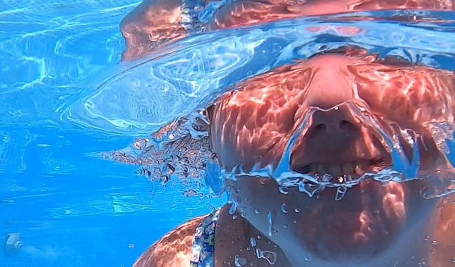 swimming under water close up